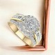 18ct Gold Diamond Ring RE27771 | Elegant 18ct Gold Diamond Ring featuring a central round diamond, surrounded by a halo of smaller diamonds and adorned with rows of baguette-cut and round diamonds on a split band.