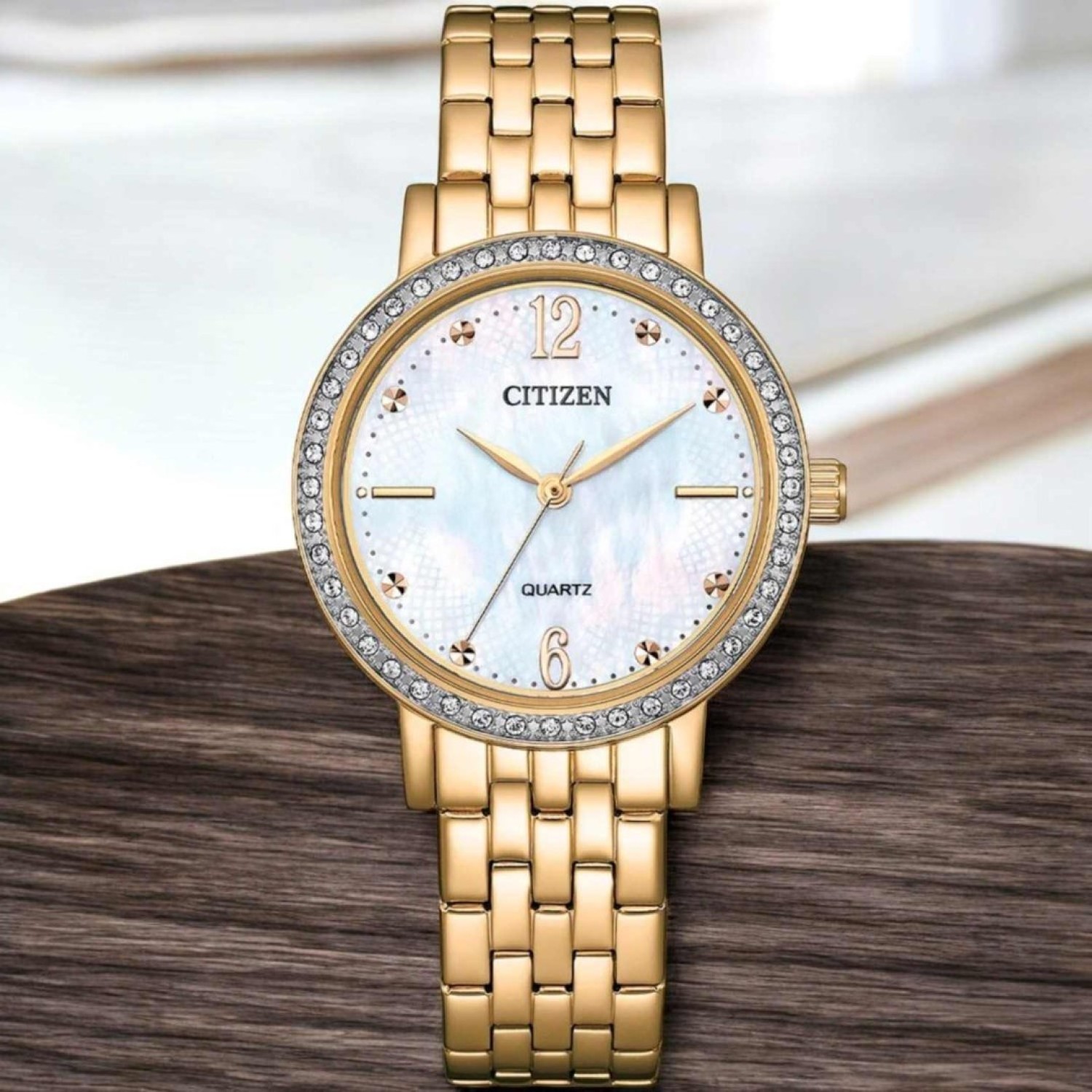 Christies Jewellery - EL3103-57D Citizen Ladies Gold Tone Watch Auckland NZ EL3103-57D Citizen Ladies Gold Tone Watch EL3103-57D Citizen Watches Auckland | White mother of Pearl Dial with crystals on Bezel