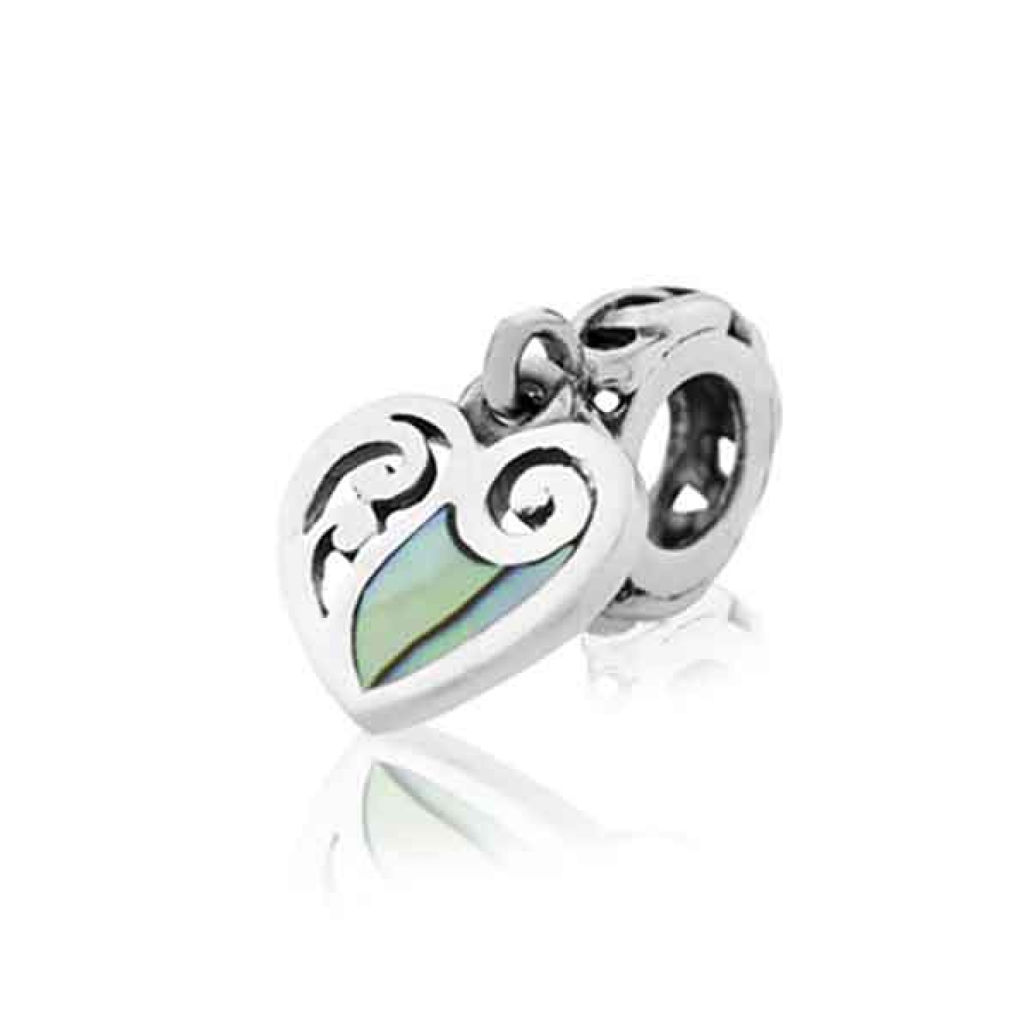 LKP002 Evolve NZ  Charms Paua Heart. Two korus form a heart that symbolises the connection and growth between two people. A smaller koru unfurls between them to represent the beauty or new life that grows from the heart. New Zealand paua is c @christies.o