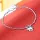 Love Locket Bracelet – Romantic Silver Heart Padlock Charm | Stolen Girlfriends Club Jewellery Love Locket Bracelet by Stolen Girlfriends Club Jewellery | Silver chain bracelet with a spiked heart-shaped padlock charm engraved with 'Stolen' and a lobster clasp closure.