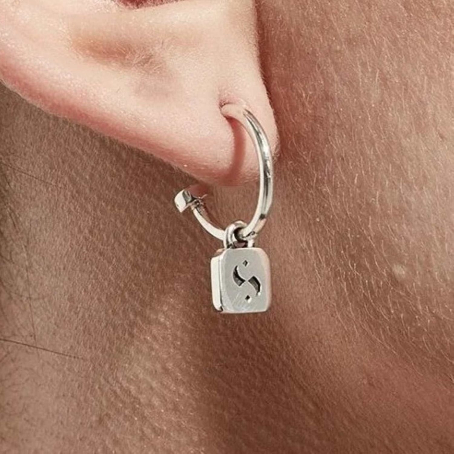 Stolen S-Logo Tag Anchor Earrings JWL1-25-3 – Stolen Girlfriends Club Jewellery | Christies Jewellery & Watches Stolen S-Logo Tag Anchor Earrings JWL1-25-3 by Stolen Girlfriends Club Jewellery | Stolen S-Logo Tag Anchor on Semi hoop with pierced earrings