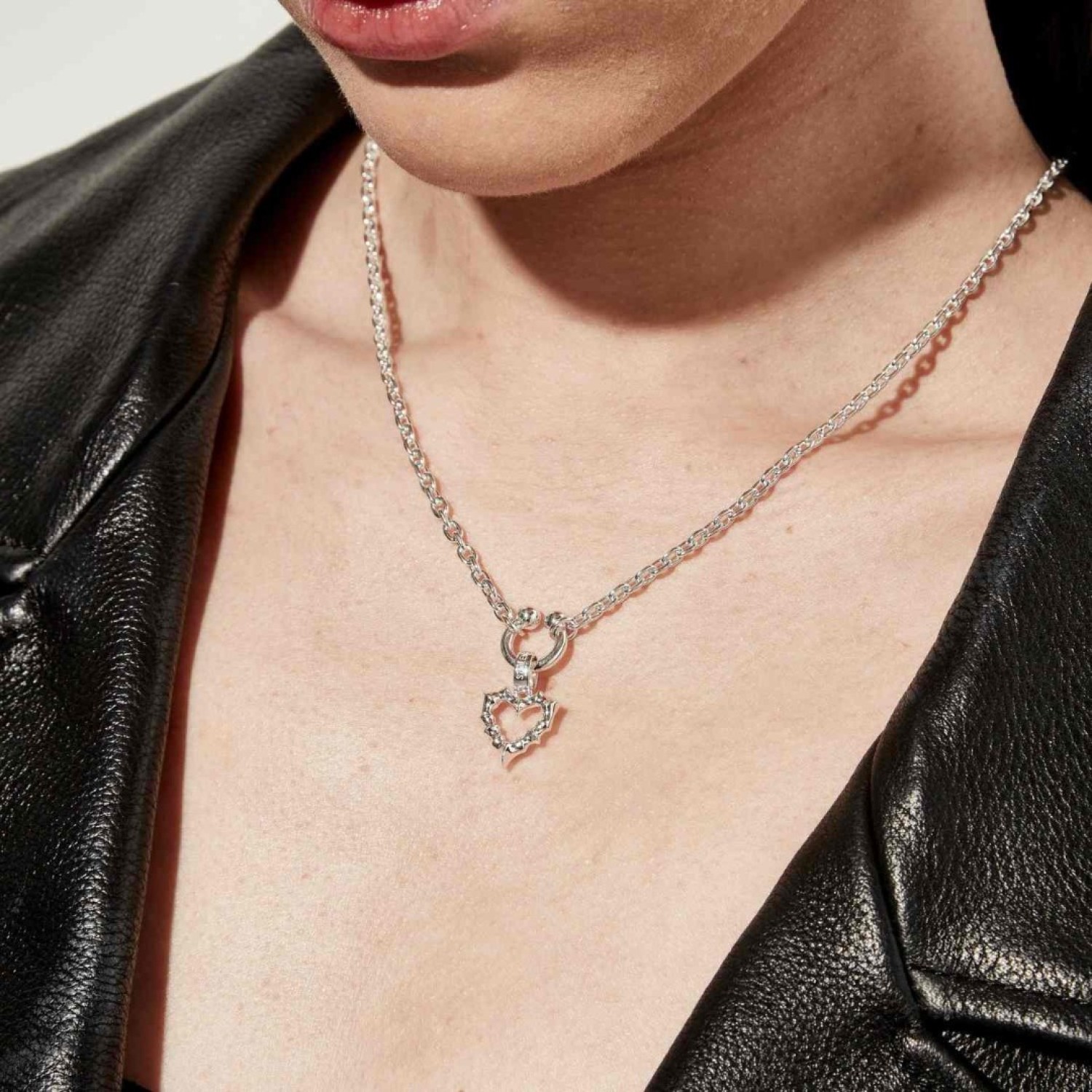 Stolen Punk Jagged Heart Necklace JWL1-25-8 – Stolen Girlfriends Club Jewellery Stolen Punk Jagged Heart Necklace JWL1-25-8 by Stolen Girlfriends Club Jewellery | Close-up of a silver punk-style necklace featuring a jagged heart-shaped pendant with a spiked design, blending edgy aesthetics with gothic charm
