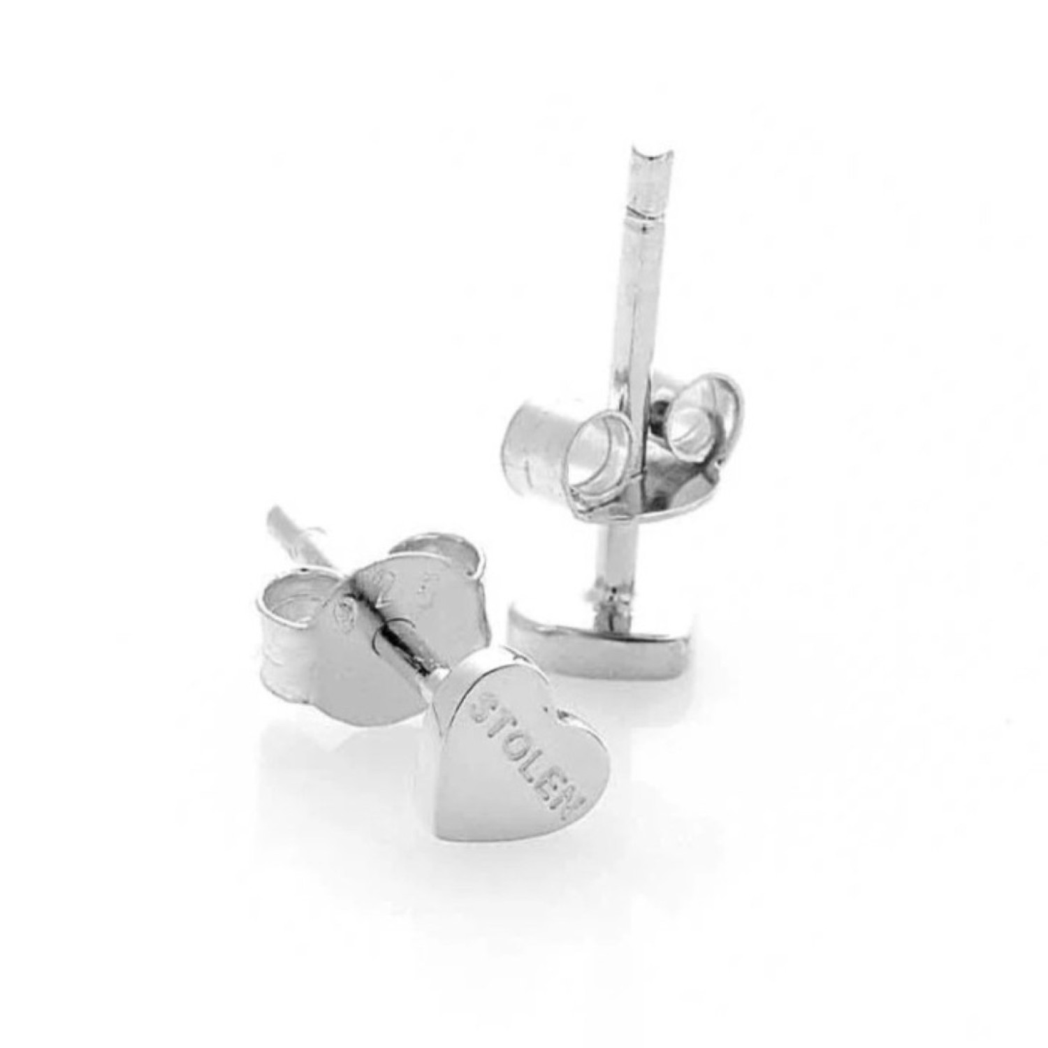 Tiny Stolen Heart Earrings – Stolen Girlfriends Club Jewellery Tiny Stolen Heart Earrings by Stolen Girlfriends Club Jewellery | A pair of heart-shaped stud earrings with the word 'STOLEN' engraved on the front of each heart.