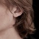 Tiny Stolen Cross Earrings JWL17004 by Stolen Girlfriends Club Jewellery | Close-up of Tiny Stolen Cross Earrings, showcasing their minimalist cross design and delicate craftsmanship, perfect for adding subtle elegance to any outfit.