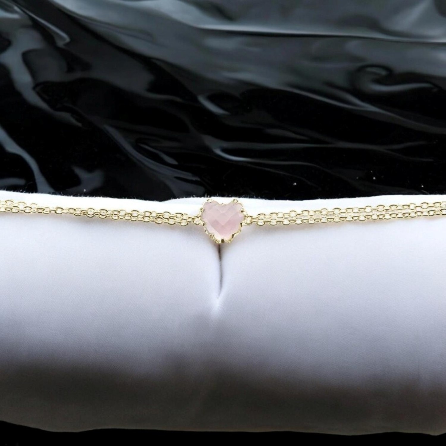 LOVE CLAW BRACELET ROSE QUARTZ - GOLD PLATED – Stolen Girlfriends Club Jewellery LOVE CLAW BRACELET ROSE QUARTZ - GOLD PLATED by Stolen Girlfriends Club Jewellery | Elegant gold-plated bracelet featuring a heart-shaped, checkerboard-cut Rose Quartz in a delicate claw setting, suspended between fine chains for a refined and timeless lo