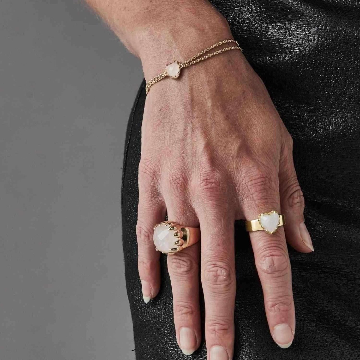 LOVE CLAW BRACELET ROSE QUARTZ - GOLD PLATED – Stolen Girlfriends Club Jewellery LOVE CLAW BRACELET ROSE QUARTZ - GOLD PLATED by Stolen Girlfriends Club Jewellery | Elegant gold-plated bracelet featuring a heart-shaped, checkerboard-cut Rose Quartz in a delicate claw setting, suspended between fine chains for a refined and timeless lo
