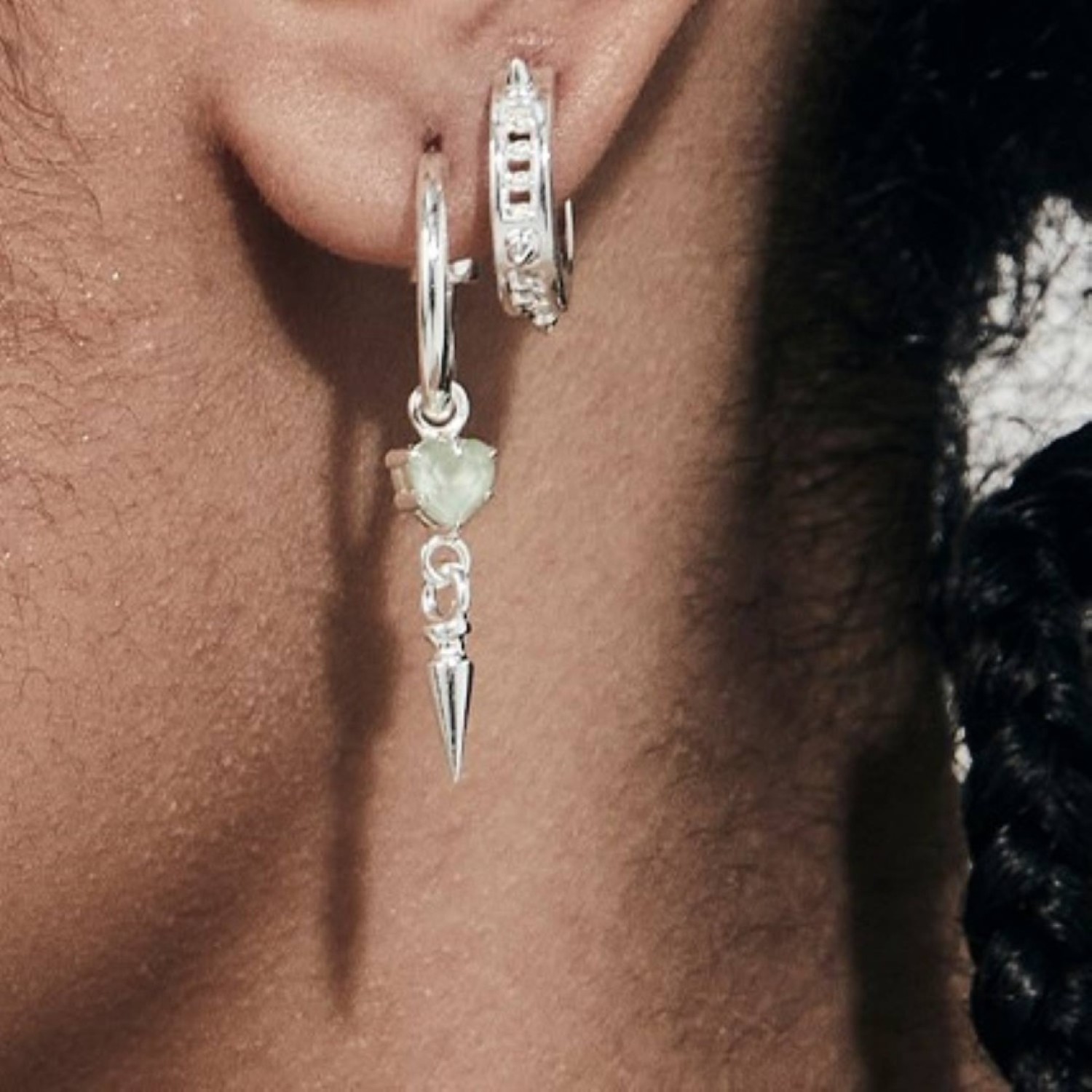 "PUNK SPIKE ANCHOR EARRINGS – Sterling Silver Hoops with Green Amethyst Heart and Spike Pendants PUNK SPIKE ANCHOR EARRINGS by Stolen Girlfriends Club, featuring sterling silver hoops adorned with green heart-shaped amethyst charms and bold spike pendants.