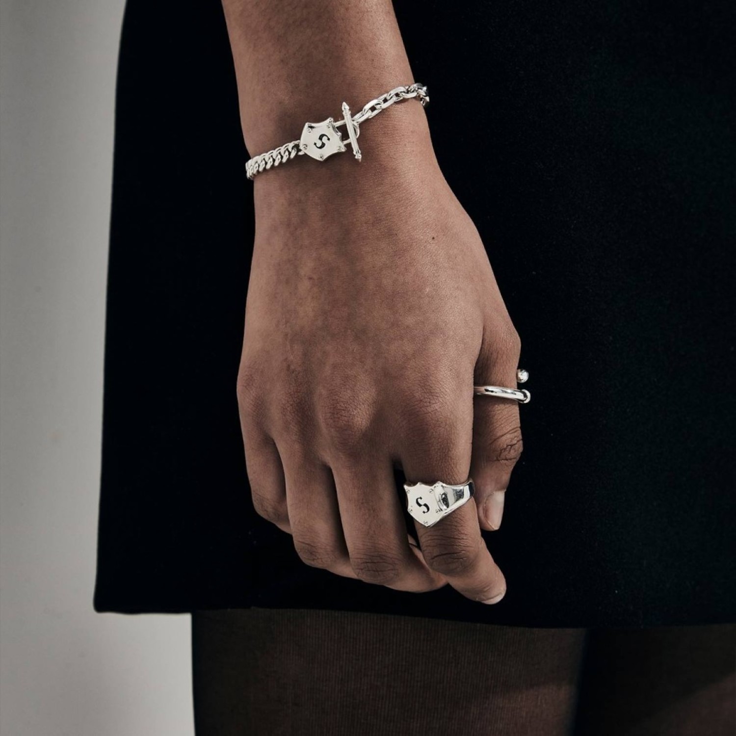 SHIELD SIGNET RING – Stolen Girlfriends Club Jewellery SHIELD SIGNET RING by Stolen Girlfriends Club Jewellery | Silver shield signet ring with an engraved letter 'S' and four small raised elements at the corners of the shield