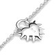 Love Locket Bracelet – Romantic Silver Heart Padlock Charm | Stolen Girlfriends Club Jewellery Love Locket Bracelet by Stolen Girlfriends Club Jewellery | Silver chain bracelet with a spiked heart-shaped padlock charm engraved with 'Stolen' and a lobster clasp closure.