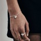 Love Locket Bracelet – Romantic Silver Heart Padlock Charm | Stolen Girlfriends Club Jewellery Love Locket Bracelet by Stolen Girlfriends Club Jewellery | Silver chain bracelet with a spiked heart-shaped padlock charm engraved with 'Stolen' and a lobster clasp closure.