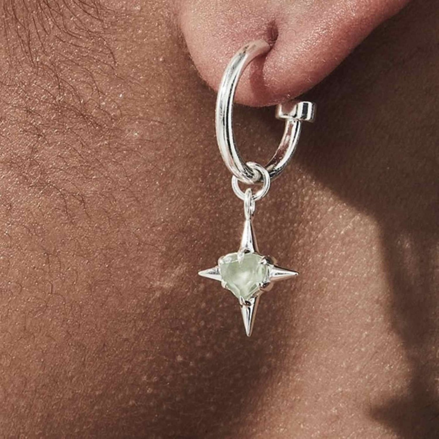 PRECIOUS PUNK ANCHOR EARRINGS – Sterling Silver Hoops with Green Amethyst Heart Charms PRECIOUS PUNK ANCHOR EARRINGS by Stolen Girlfriends Club, featuring heart-shaped green amethyst stones suspended on polished sterling silver hoops with butterfly fastenings.