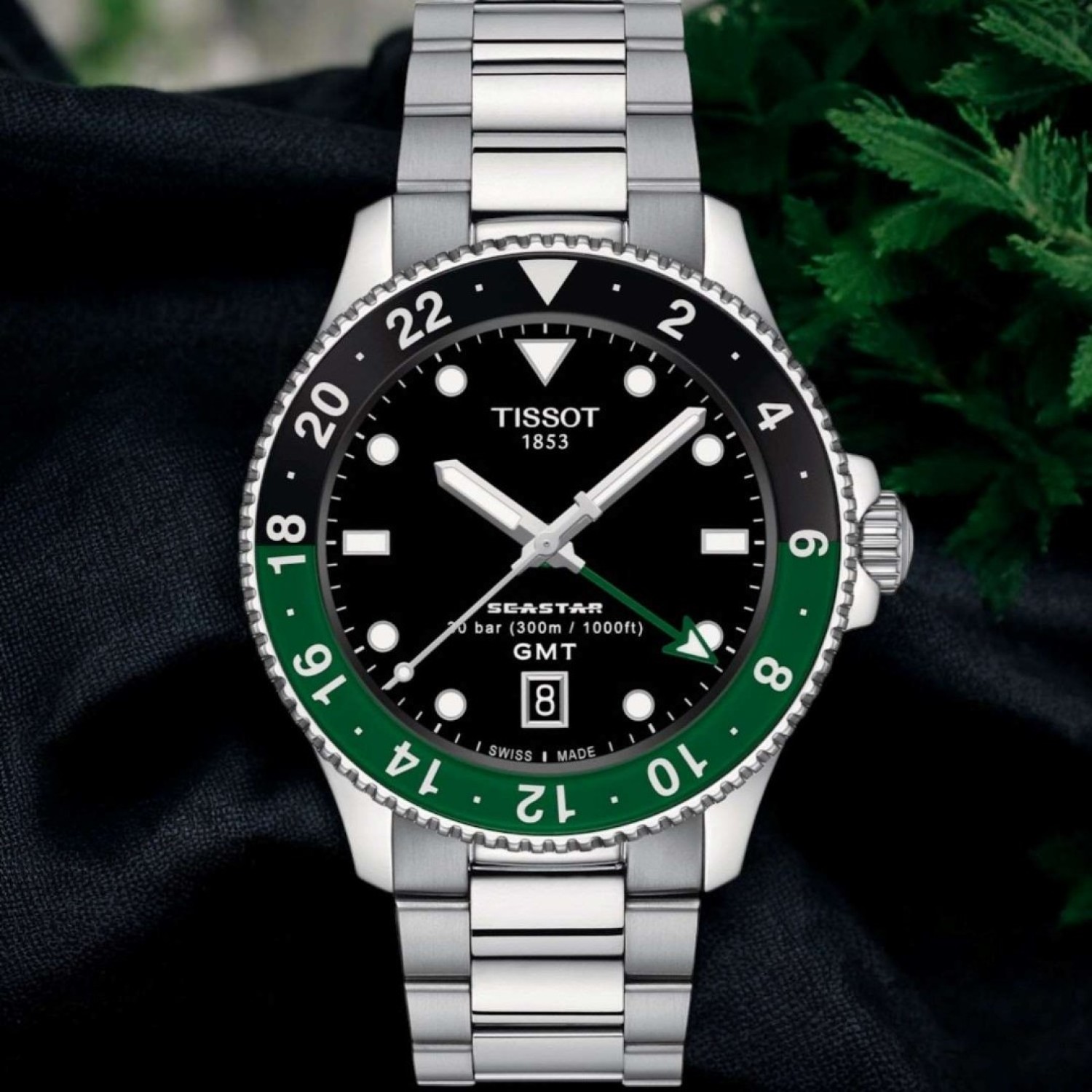 Christies Jewellery - Tissot Seastar 1000 Quartz GMT T1208521105100 Auckland NZ Tissot Seastar 1000 Quartz GMT T1208521105100 with stainless steel casing, black dial, and black-green bezel.
