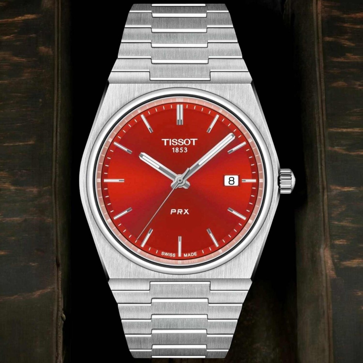 Tissot PRX Red Dial 40mm T1374101142100 – Tissot Watches NZ Tissot PRX Red Dial 40mm T1374101142100 by Tissot Watches NZ | Red Tissot PRX wristwatch with a stainless steel dial, silver hour markers, a date window at 3 o'clock, and 'PRX' elegantly inscribed above the 6 o'clock position.