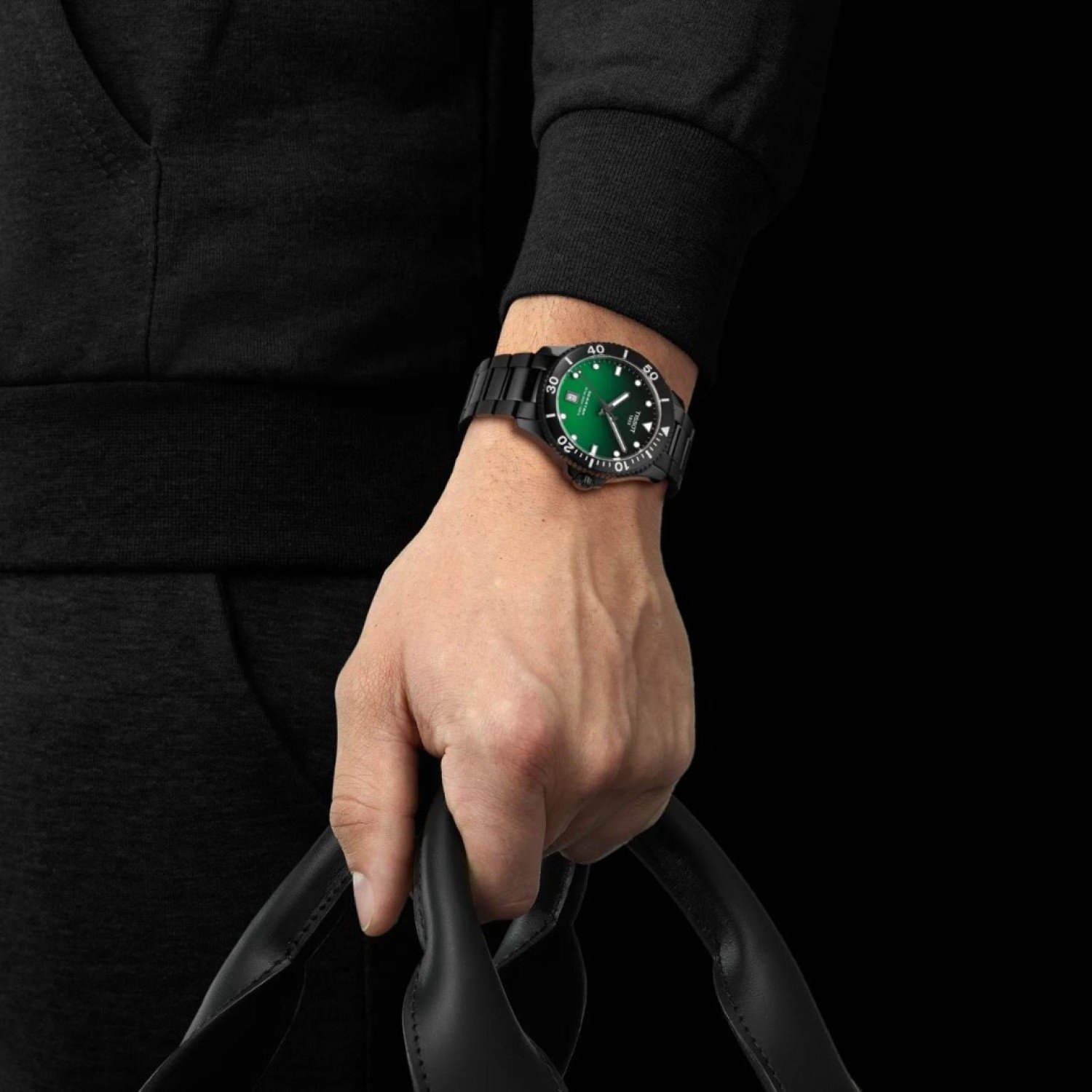 Tissot Seastar 1000 Quartz 40MM T1204103309100 watch with a green dial, black bezel, and black metal bracelet, featuring white hour markers, a date window at 6 o’clock, and water resistance up to 300m. Tissot Seastar 1000 Quartz 40MM T1204103309100 by Tissot Watches NZ | Order now for Fast Free Delivery and 7 Day NZ support online and Instore at our Auckland Stores.