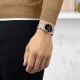 TISSOT PRX Powermatic 80 18K Gold Bezel 40mm T9314074104100 by Tissot Watches NZ | Tissot PRX Powermatic 80 with a rose gold bezel, black dial, and stainless steel bracelet, featuring sleek hour markers and a date window at 3 o'clock.