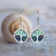 Evolve Tree of Life Paua Drop Earrings featuring a Tree of Life design with natural paua shell accents on a white background.