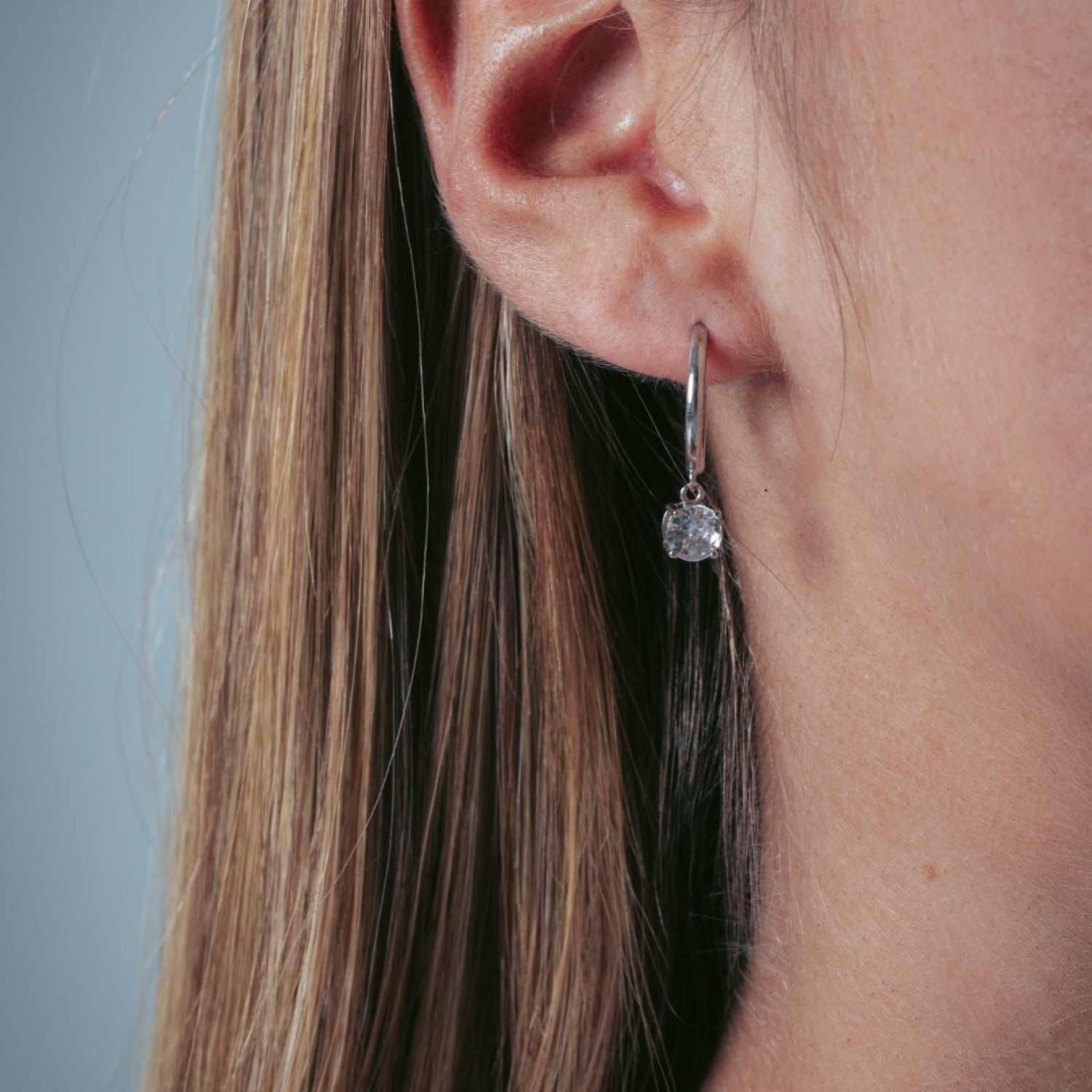 Georgini Bria Hoop Silver Earrings IE934W - High Shine Finish with Dangling CZ Georgini Bria Hoop Silver Earrings IE934W with High Polished Finish and Dangling CZ.