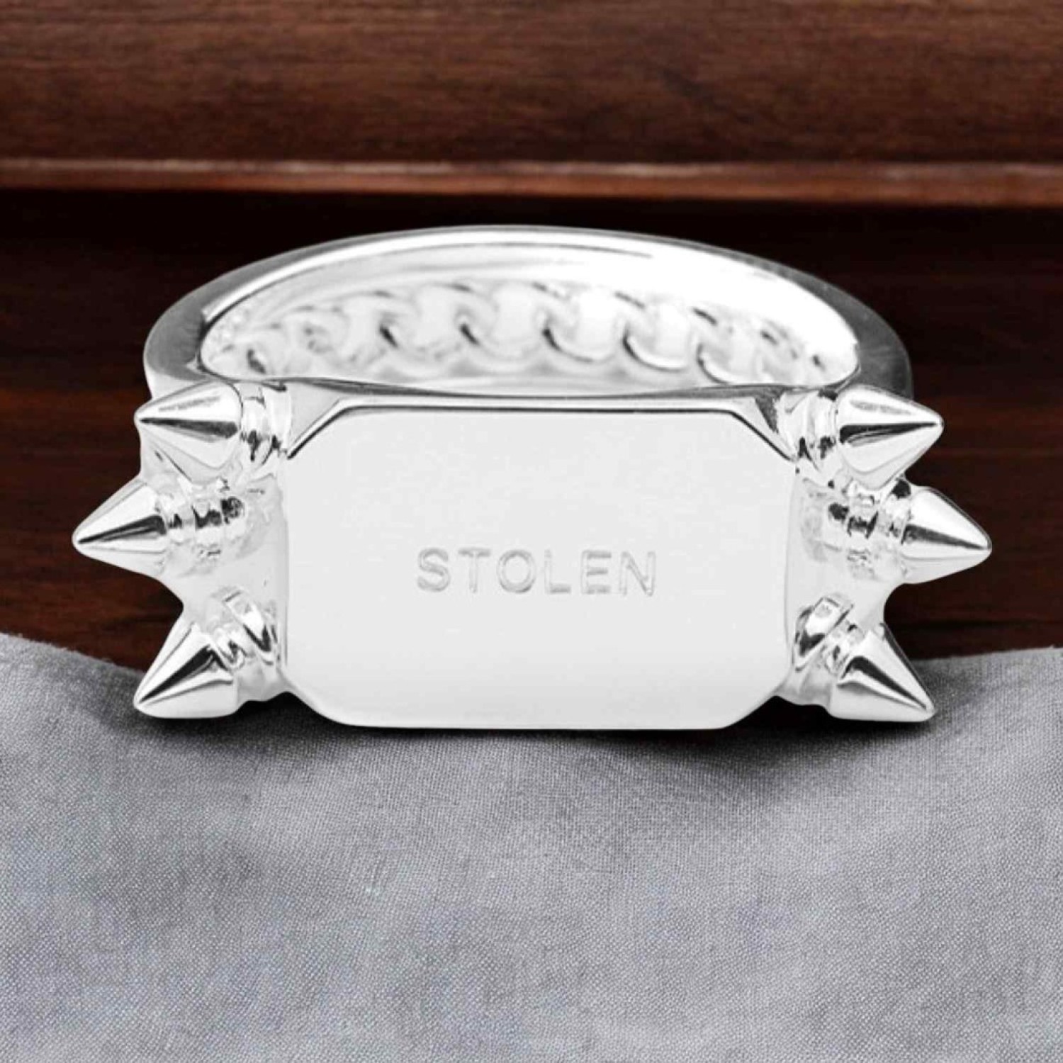 Precious Punk Block Ring with Spiked Design and Branded Plate PRECIOUS PUNK BLOCK RING by Stolen Girlfriends Club Jewellery | featuring sharp spikes, intricate band detailing, and a branded plate, showcasing its edgy yet luxurious design.