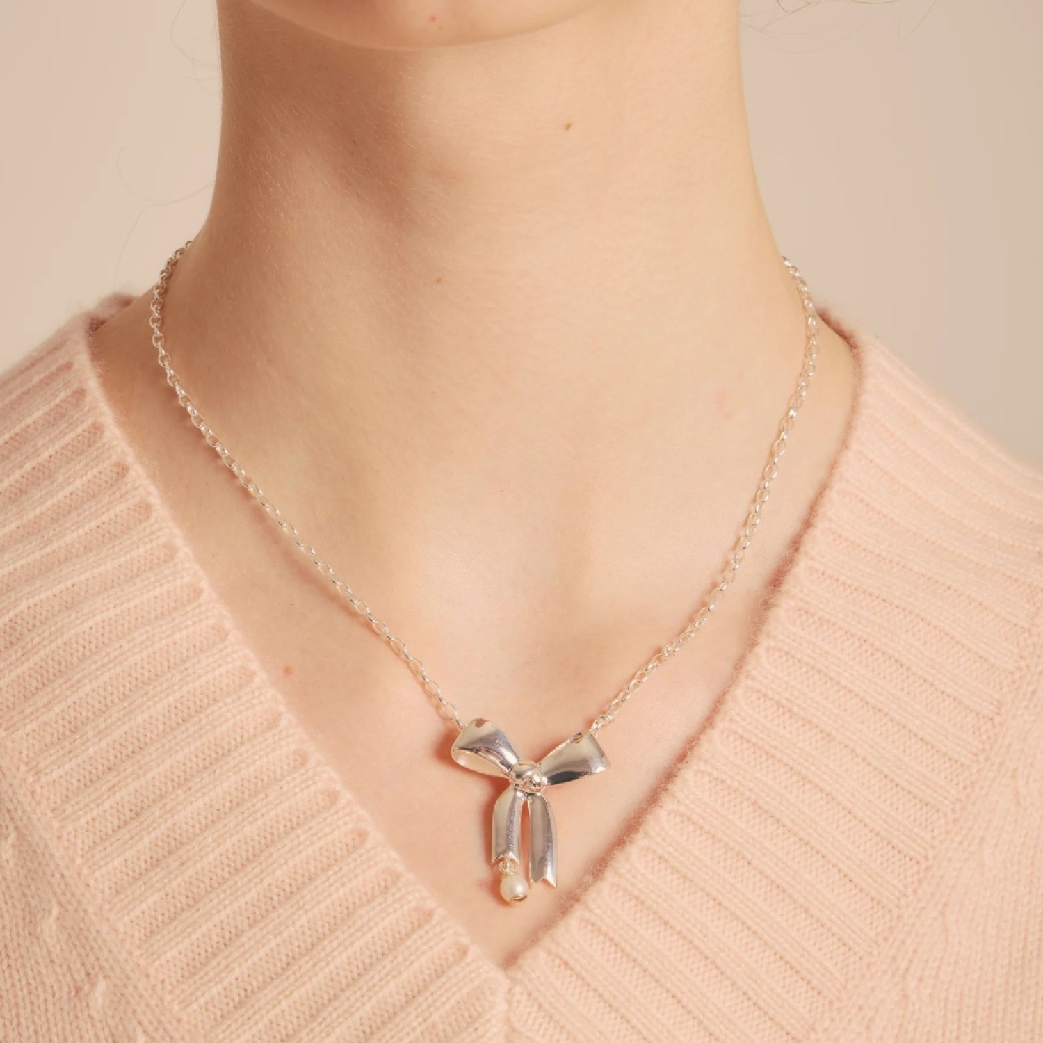 Karen Walker Bow Necklace – Sterling Silver & Pearl | KW490PN-STG-FWP Karen Walker Bow Necklace in Sterling Silver with Pearl – KW490PN-STG-FWP