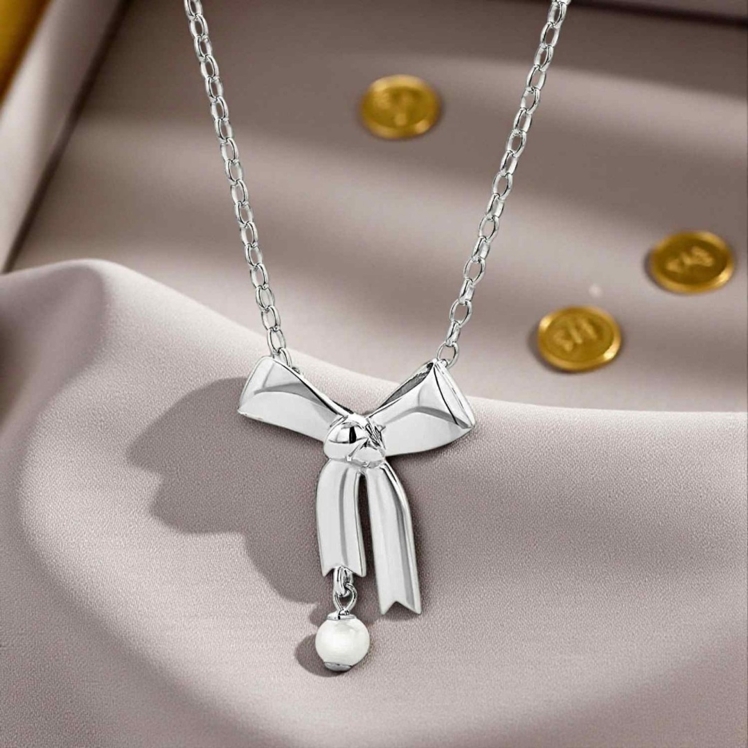 Karen Walker Bow Necklace – Sterling Silver & Pearl | KW490PN-STG-FWP Karen Walker Bow Necklace in Sterling Silver with Pearl – KW490PN-STG-FWP