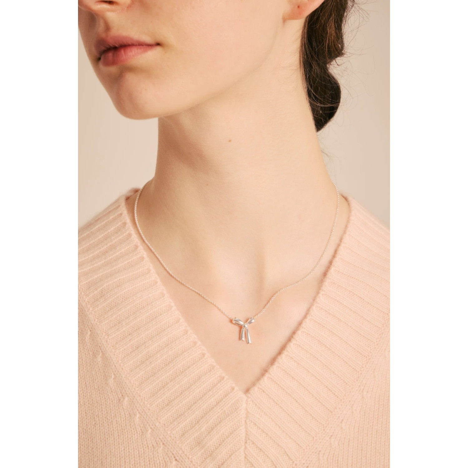 Karen Walker Sterling Silver Small Bow Necklace Karen Walker Small Bow Necklace in sterling silver minimalist bow pendant
